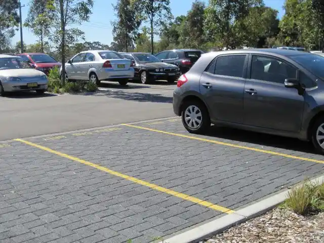 Concrete Parking Areas Planned for Vehicles, Access, and Drainage